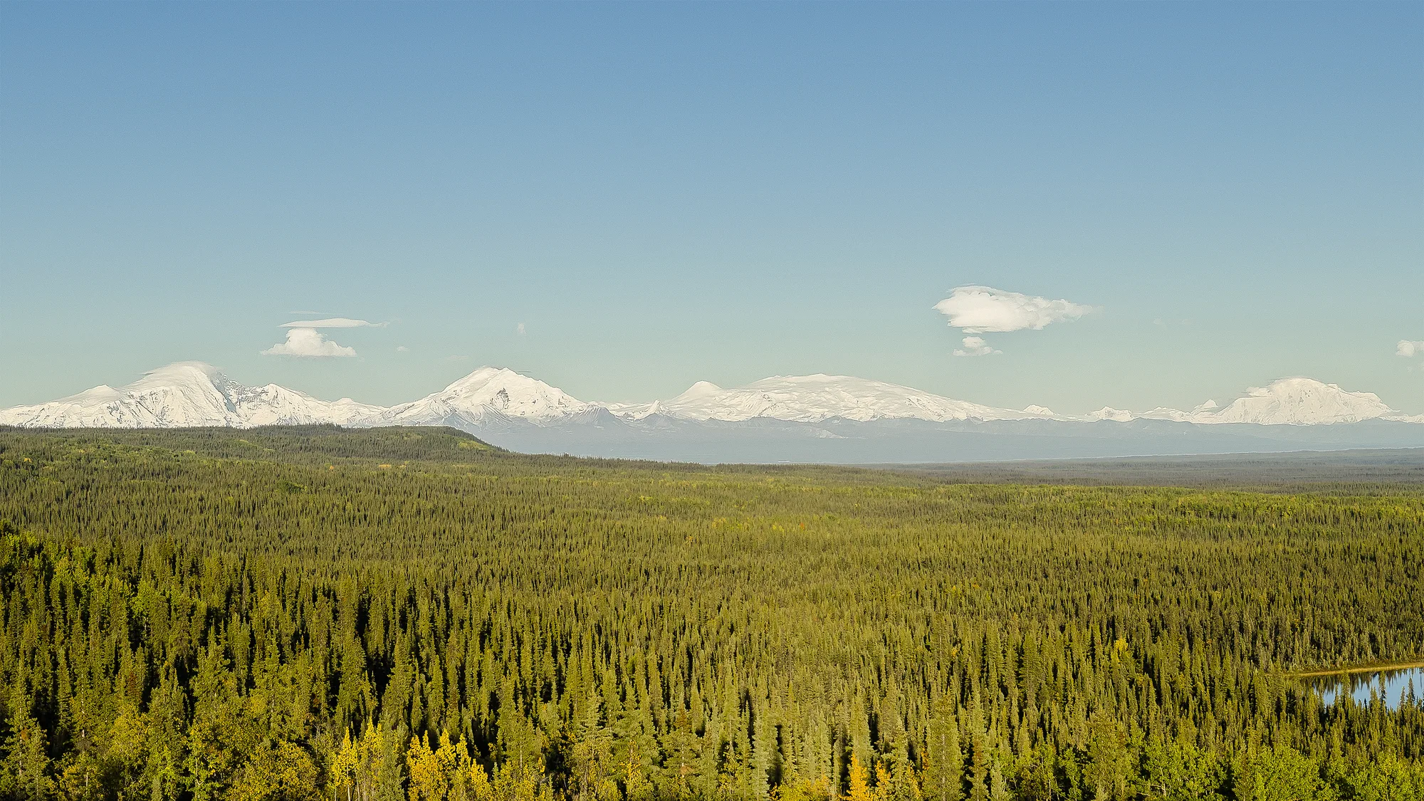 A guided tour group walking through the Kennecott mill complex, Wrangell-St. Elias National Park